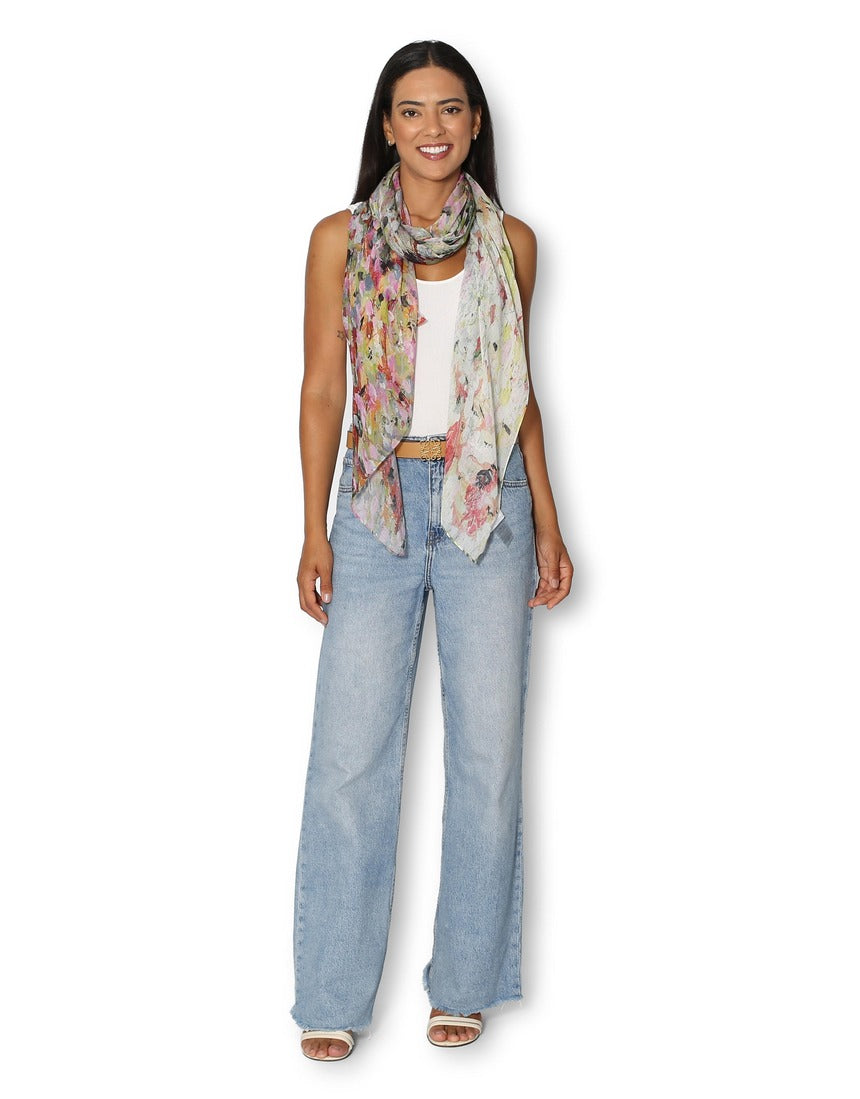 Model wearing The Artists Label Julie’s Garden scarf featuring floral patterns and vibrant colors.