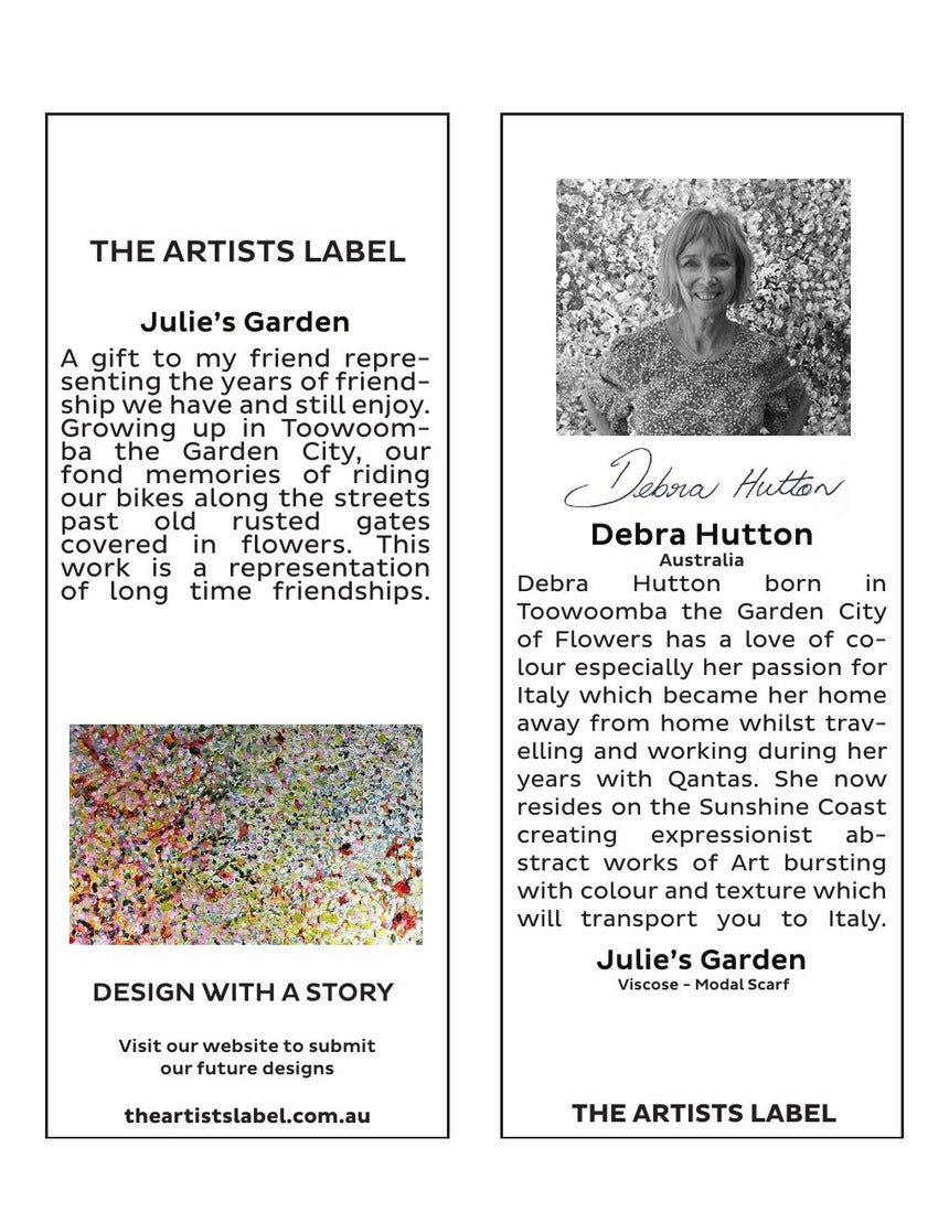 The Artists Label Julie’s Garden scarf draped on a hanger, showcasing vibrant floral patterns and lightweight fabric.