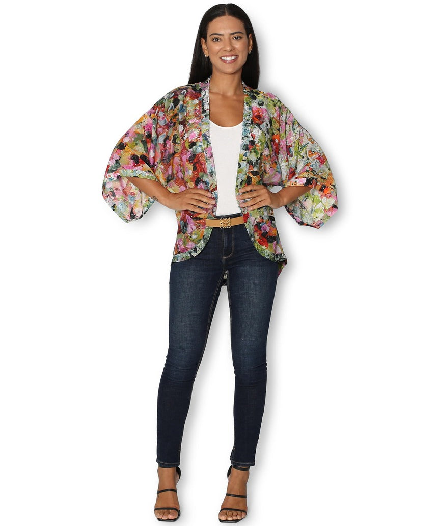 The Artists Label Julie’s Garden silk kimono displaying a floral pattern, front view with flowing fabric and elegant design.
