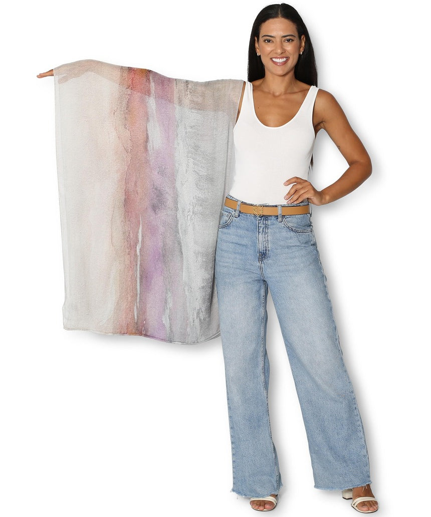 The Artists Label Transformation infinity scarf featuring a colorful, abstract pattern in soft fabric, laid flat for display.