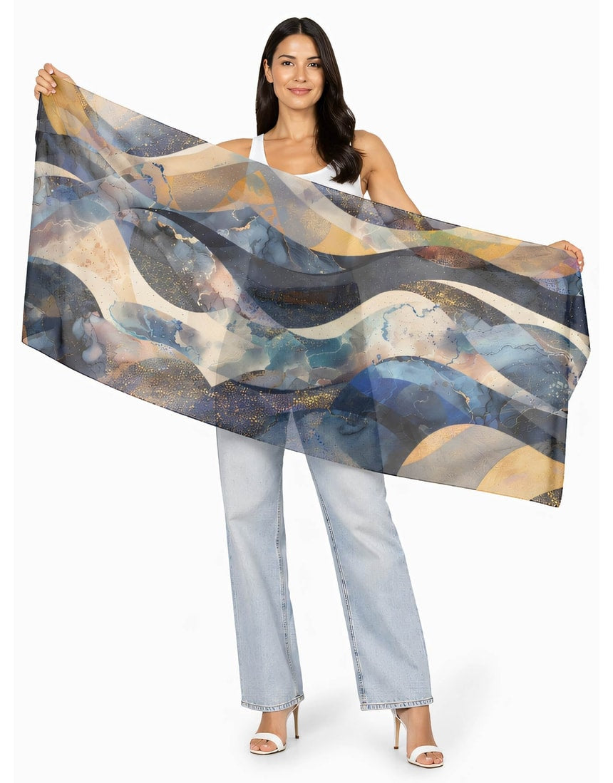 The Artists Label Celestial Waves viscose modal scarf featuring a flowing wave pattern in soft blue and white tones.
