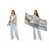 The Artists Label Reaching Light viscose modal scarf featuring soft fabric with a flowing, artistic design in light tones.