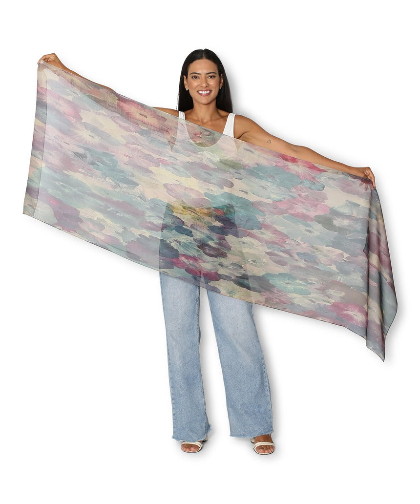 Silk chiffon scarf by The Artists Label featuring a delicate wandering through petals floral pattern in soft colors.