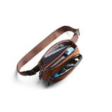 Bellroy Venture Hip Pack in bronze with adjustable strap and multiple compartments, designed for convenient everyday carrying.