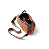 Bellroy Venture Hip Pack in bronze with multiple compartments and adjustable strap, designed for convenient everyday carry.