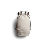 Bellroy Lite Daypack in Ash color, showing a sleek compact backpack with multiple compartments and adjustable shoulder straps.