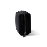 Bellroy Tech Kit in black showing compact design with multiple compartments for organizing cables and accessories.