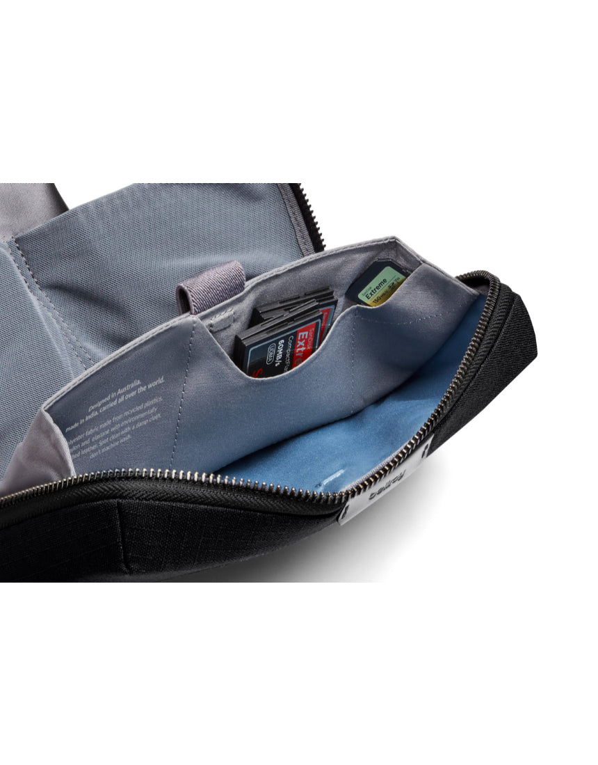 Bellroy Tech Kit in black with multiple compartments for organizing cables, chargers, and accessories.