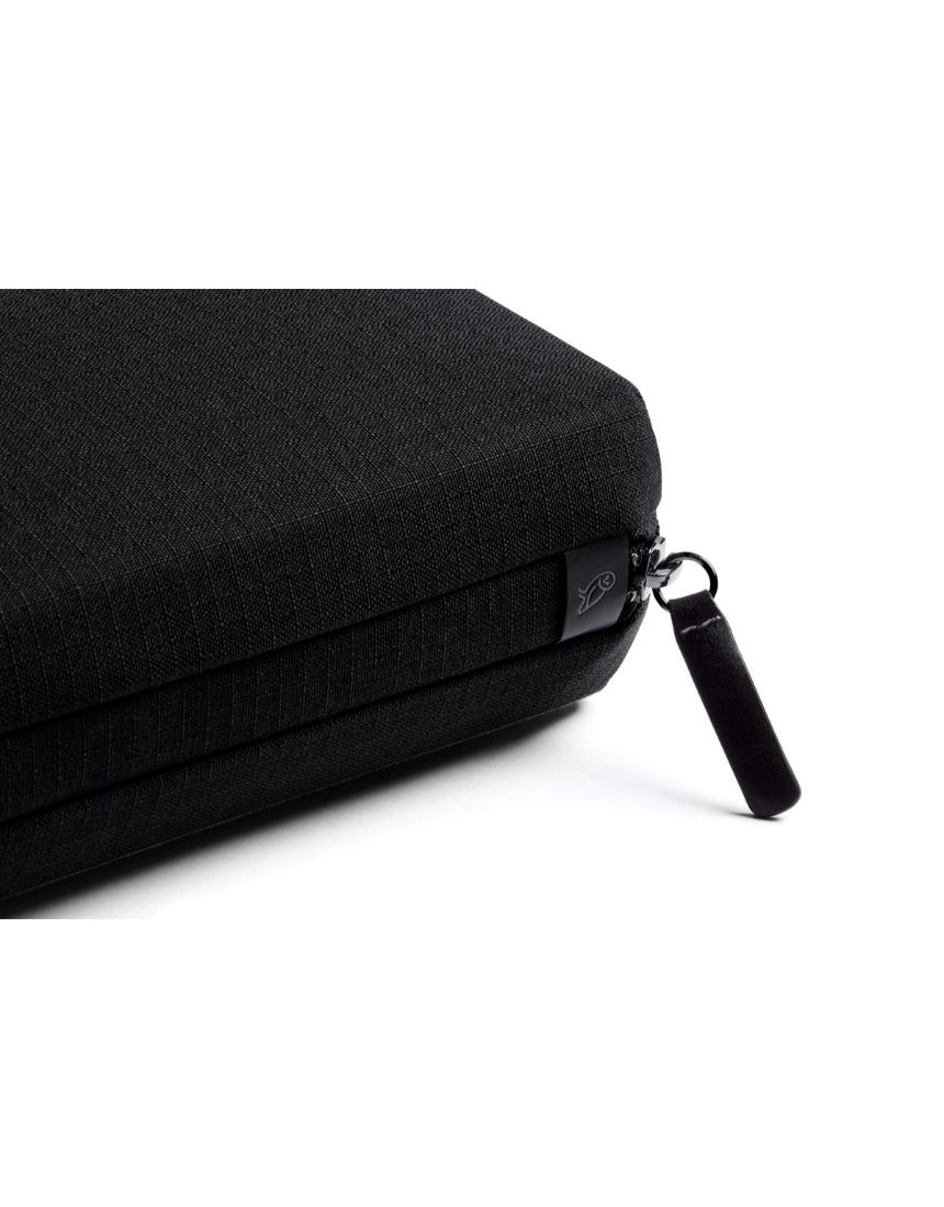 Bellroy Tech Kit in black with organized compartments for cables, chargers, and accessories, compact and stylish travel organizer.