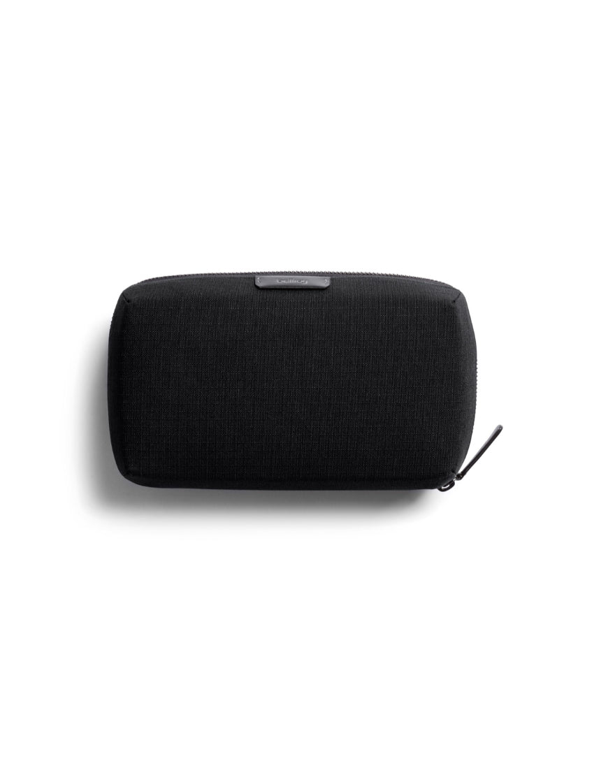 Bellroy Tech Kit in black, compact organizer with multiple compartments for cables, accessories, and gadgets.