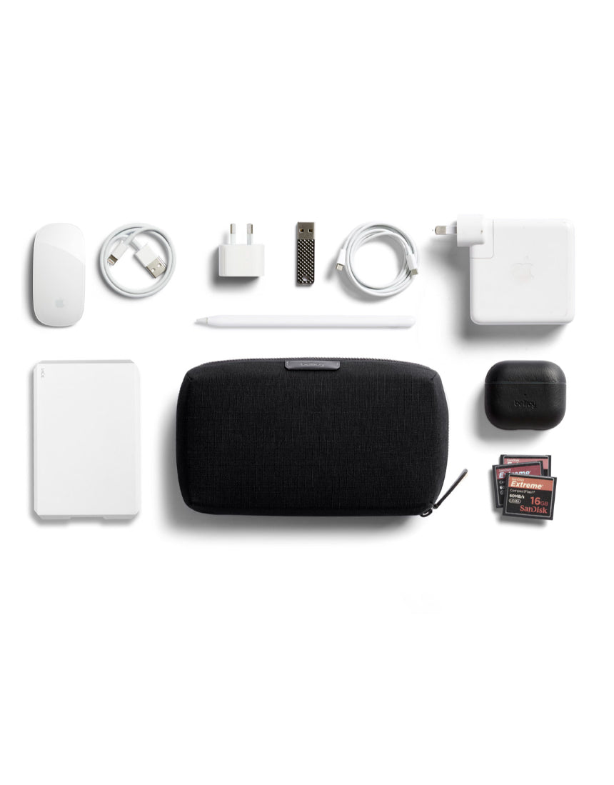 Bellroy Tech Kit in black, compact organizer with multiple compartments for cables, accessories, and electronic gadgets.