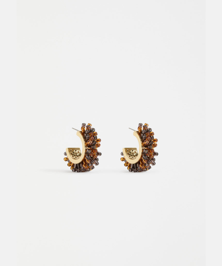 Elk Karan small hoop earrings in tortoiseshell with gold-tone accents, showcasing a stylish and lightweight jewelry design.