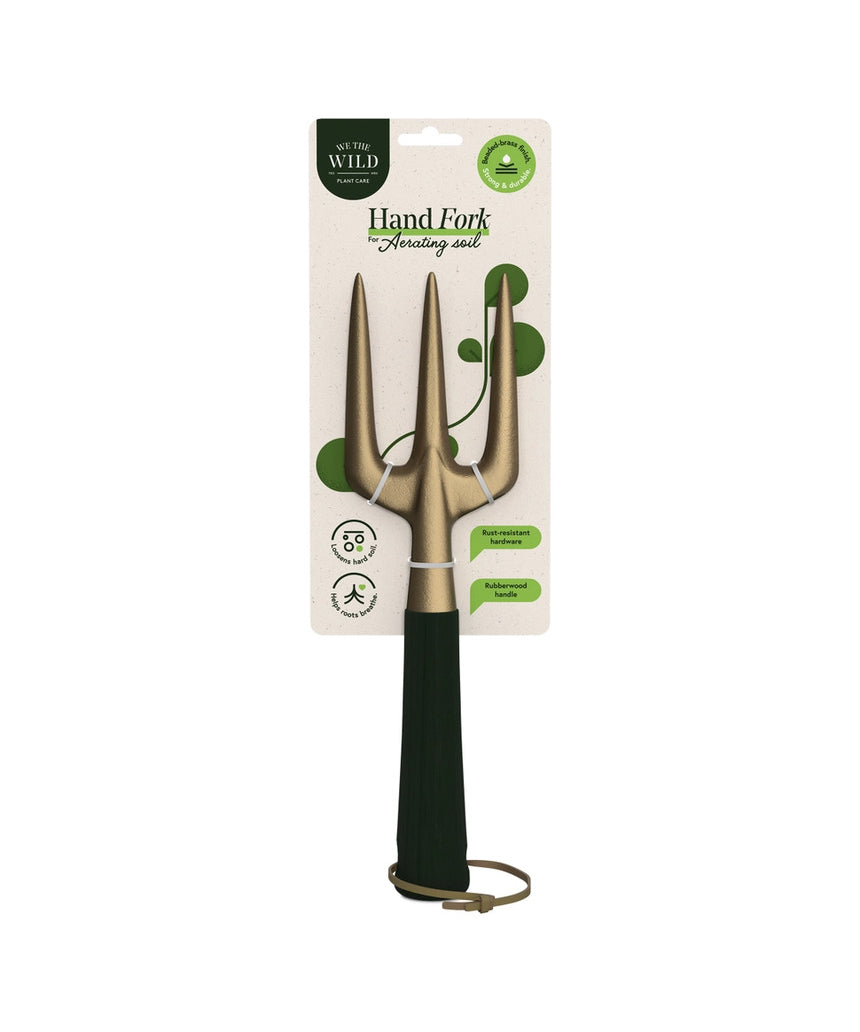 Green We The Wild hand fork garden tool with ergonomic handle and metal tines for planting and cultivating in the garden.