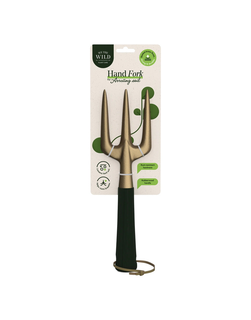 Green We The Wild hand fork garden tool with ergonomic handle and metal tines for planting and cultivating in the garden.