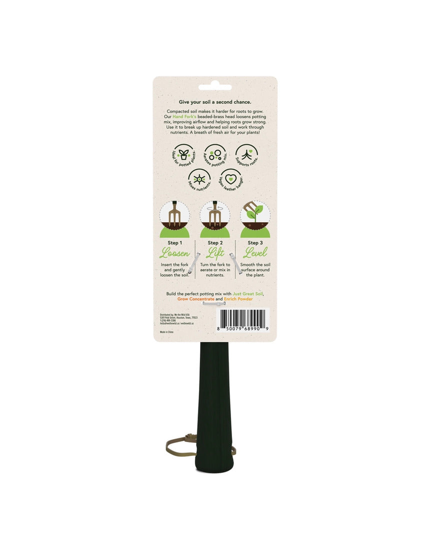 Green We The Wild hand fork garden tool with a sturdy handle and tines for planting and cultivating in the garden.