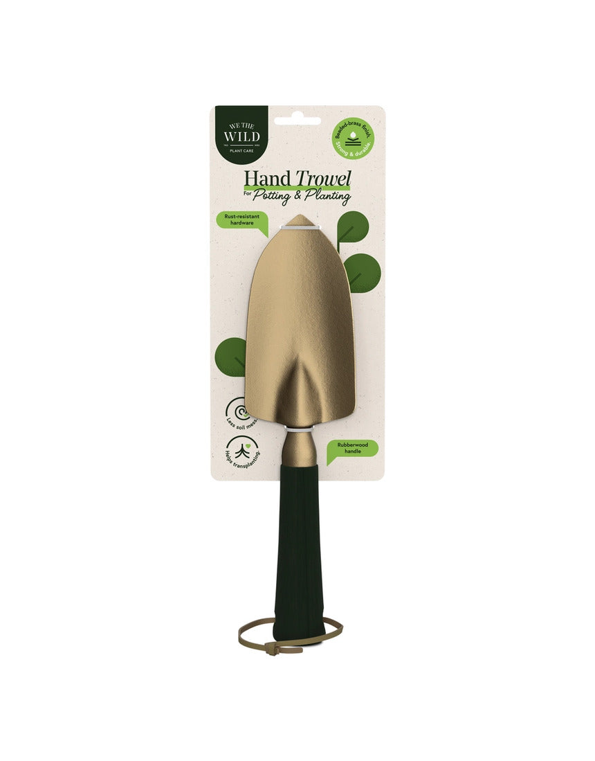 Green We The Wild hand trowel, a durable garden tool with a comfortable handle, ideal for planting and gardening tasks.