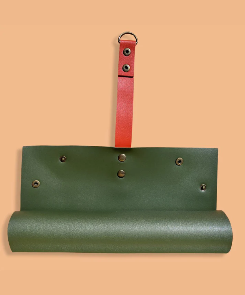 Large We The Wild reusable potting mat with green surface and textured design for gardening and plant potting.