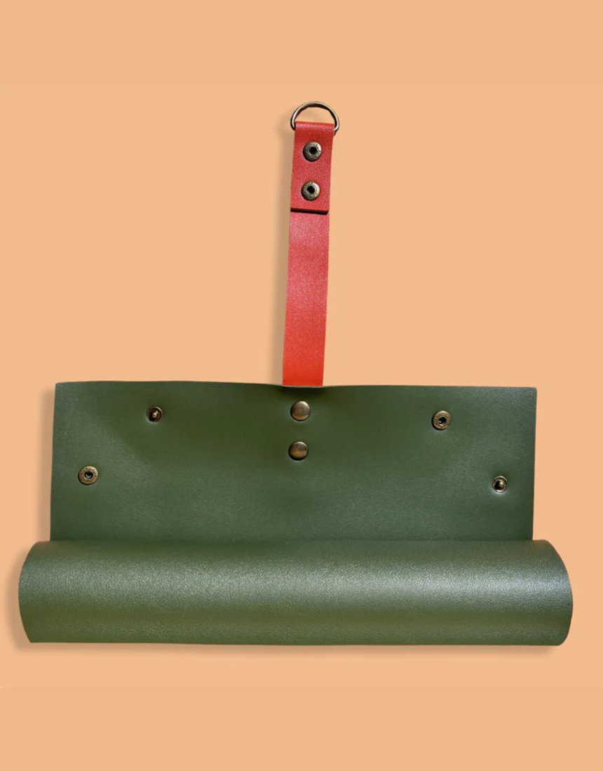 Large We The Wild reusable potting mat with green surface and textured design for gardening and plant potting.