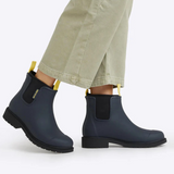 Merry People Bobbi Gumboots in midnight color, waterproof rubber boots with a sleek design and sturdy soles for wet weather.