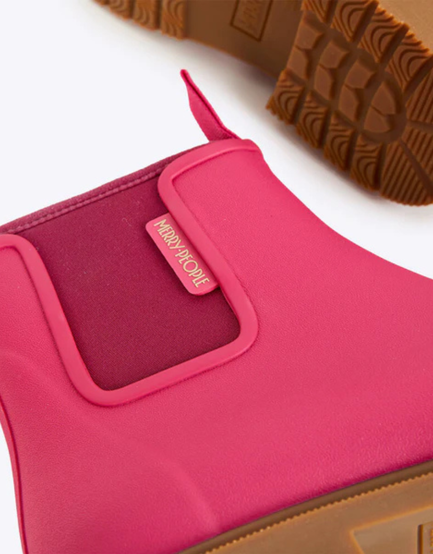 Fuchsia pink Merry People Bobbi gumboots with waterproof rubber and sturdy soles, designed for outdoor wear.