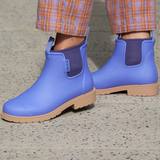 Violet and blue Merry People Bobbi gumboots with floral pattern, waterproof rubber footwear for rainy weather.
