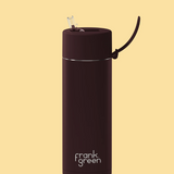 Frank Green 595ml chocolate-colored drinkware bottle, sleek design with a spill-proof lid, perfect for on-the-go beverages.