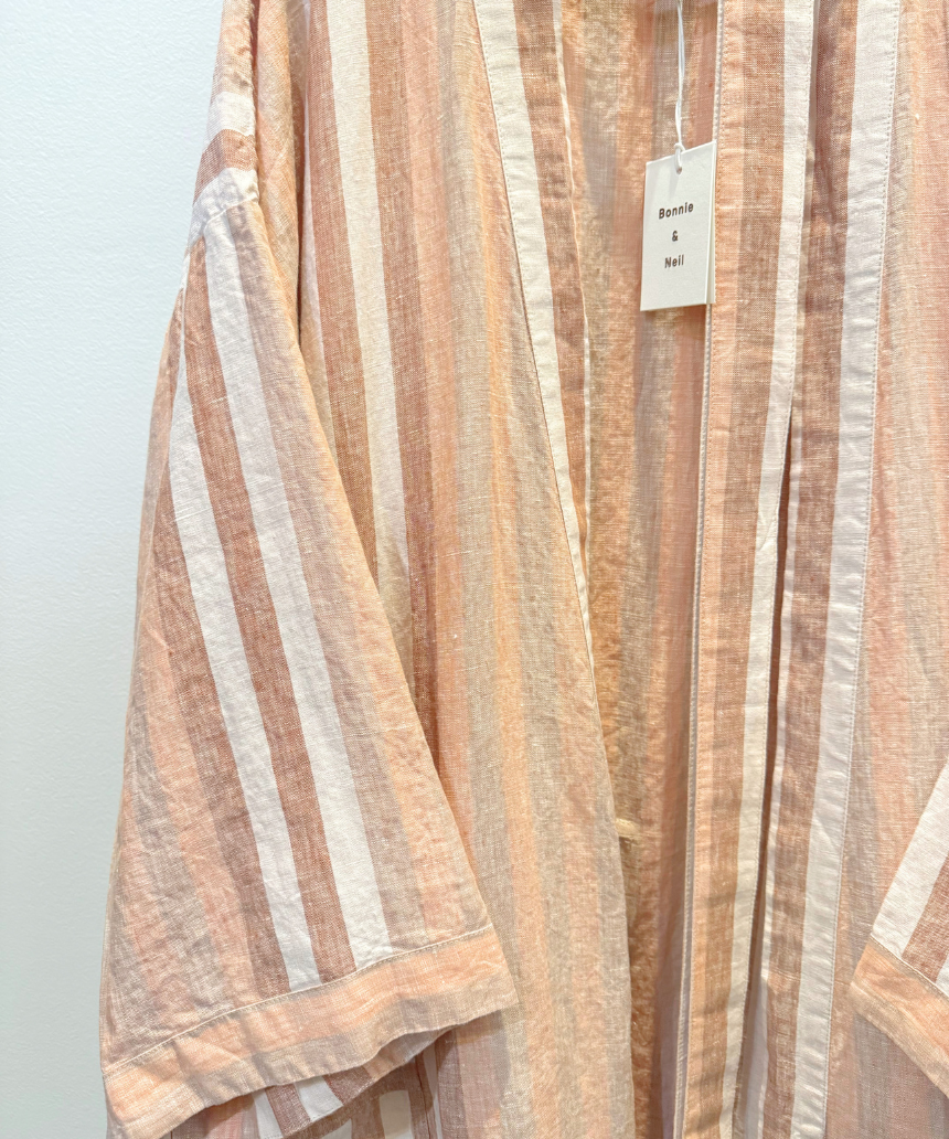 Hazelnut striped robe by Bonnie and Neil, featuring soft fabric and cozy design, displayed on a hanger against a neutral background.