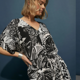 Elk Lento Dress in soft fabric, featuring a relaxed fit and stylish design, displayed on a hanger.