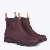 Dark cherry Merry People Bobbi gumboots with black rubber soles, stylish waterproof footwear for rainy days.