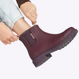 Dark cherry Merry People Bobbi gumboots with waterproof design and glossy finish, suitable for rainy weather.