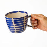 Jones & Co Chino Mug Boss Blue Stripe with bold blue and white striped design, ceramic coffee mug on a white background.