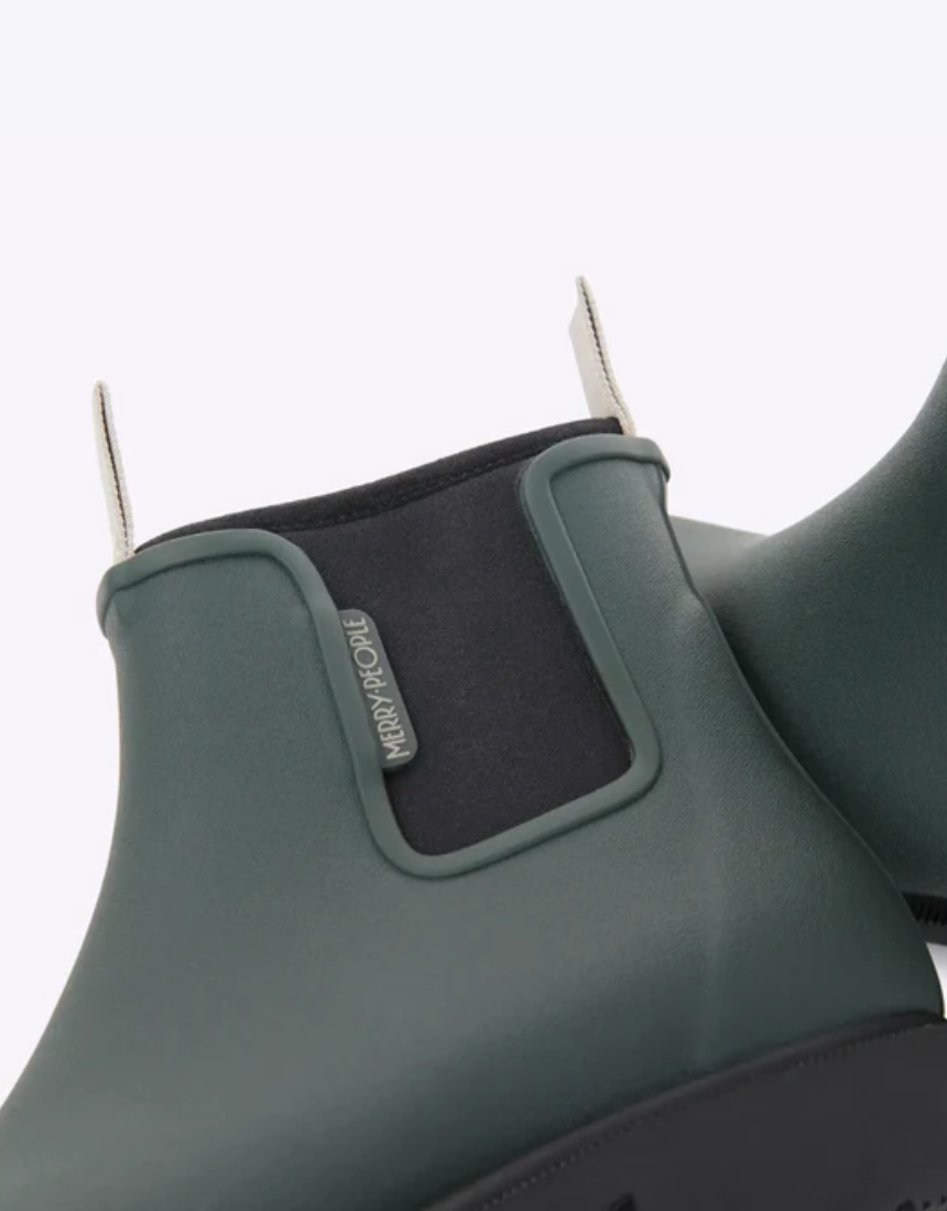 Forest green Merry People Bobbi gumboots shown with shiny rubber finish and sturdy soles, perfect for rainy weather.