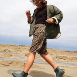 Merry People Bobbi gumboots in forest green, waterproof rubber footwear for women, with a sturdy sole and stylish design.