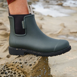 Forest green Merry People Bobbi gumboots with waterproof rubber and stylish design, perfect for rainy days.