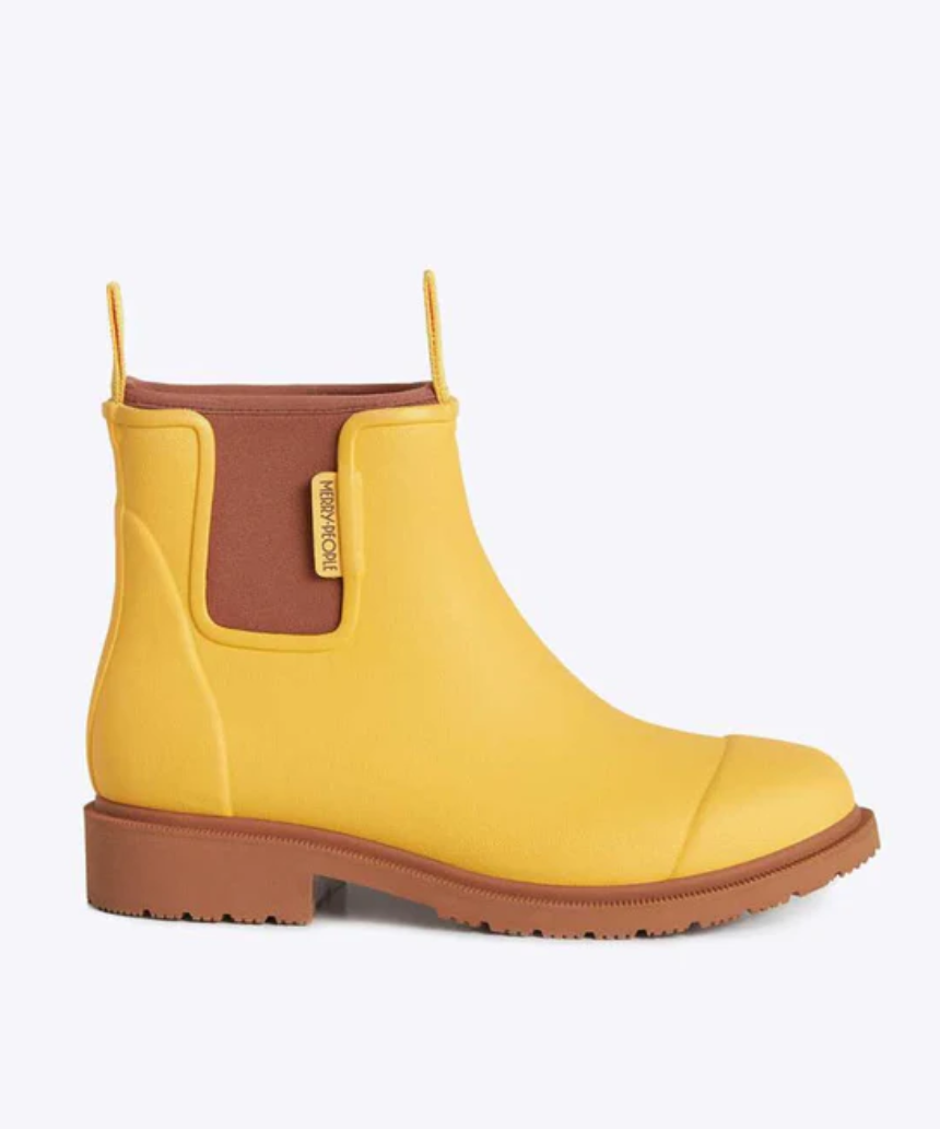 Yellow Merry People Bobbi gumboots with sunflower pattern, waterproof rubber footwear for rainy days.