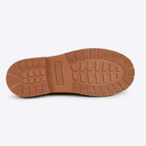 Yellow Merry People Bobbi gumboots with sunflower design, waterproof rubber footwear for rainy weather.