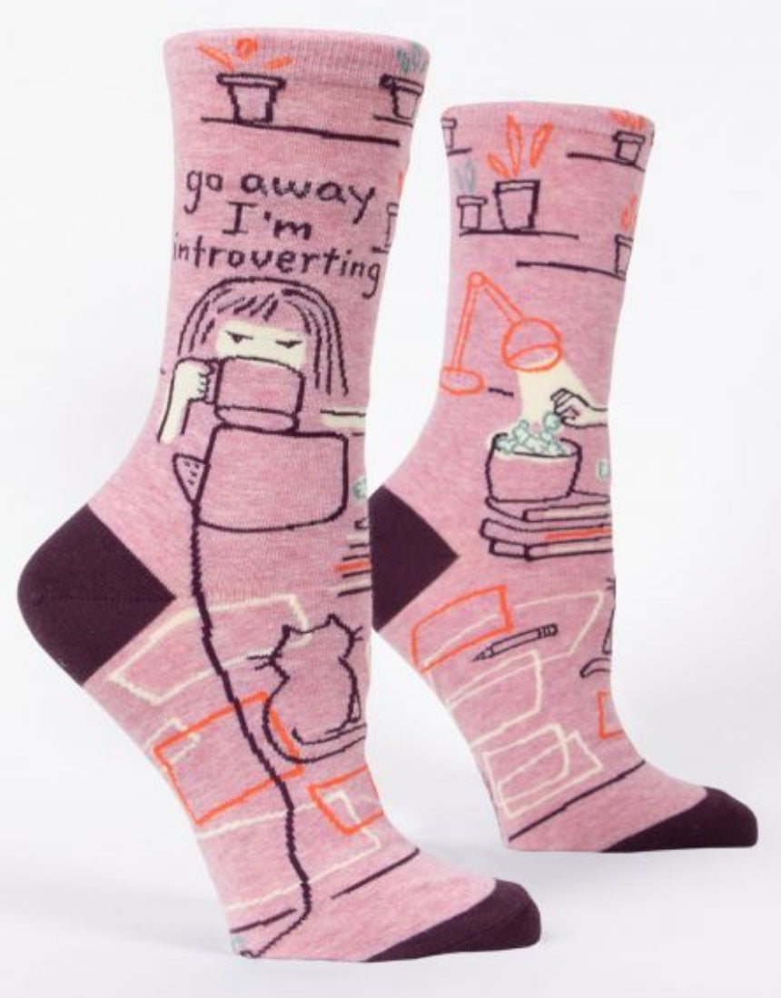 Blue Q crew socks featuring humorous "Go Away I'm Introverting" design in blue and white, casual and comfortable footwear.