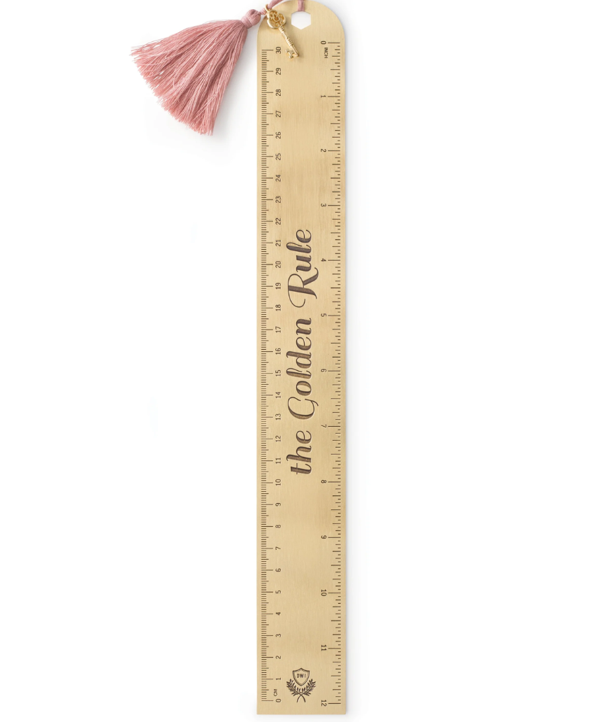 Designworks Ink metal 12-inch ruler with tassel and charm, featuring "The Golden Rule" design for artistic and craft projects.