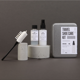 Men's Society travel shoe care kit with brushes, polish, and accessories for men's shoe maintenance and cleaning.