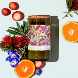 Mojo Candle Co. Bottlebrush Australiana Collection candle with a decorative label and natural wax finish.