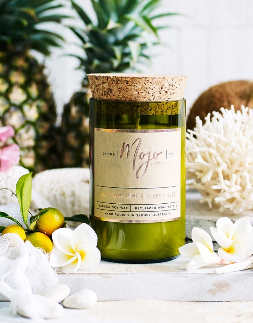 Mojo Candle Co. sweet tangerine and island fruits scented candle with vibrant orange and tropical fruit design.