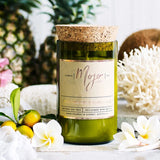 Mojo Candle Co. sweet tangerine and island fruits scented candle with vibrant orange and tropical fruit design.