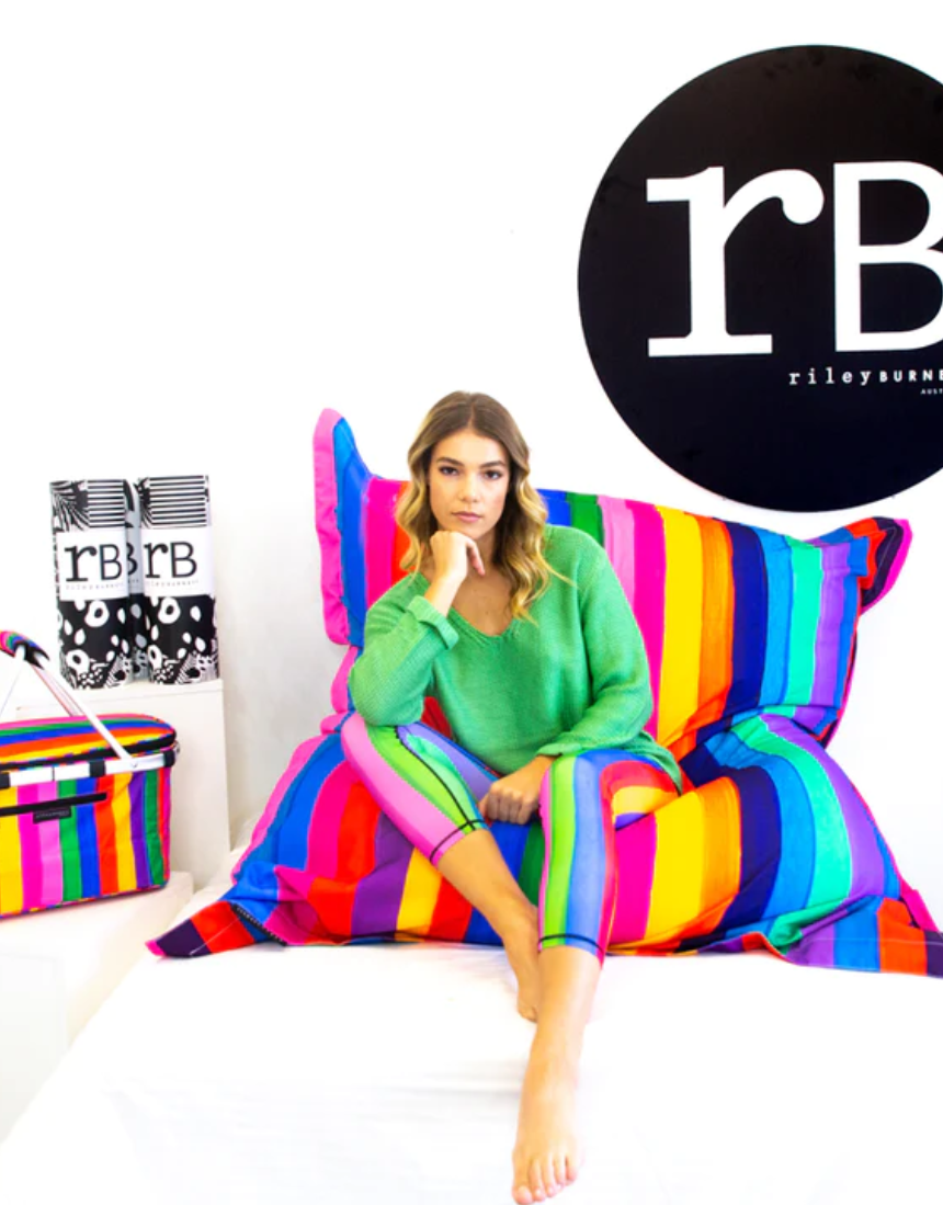Riley Burnett Carnival Stripe Bean Bag Picnic Rug with colorful striped fabric and comfortable padding for outdoor seating