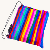 Riley Burnett carnival stripe picnic rug with colorful striped fabric, perfect for outdoor picnics and gatherings.