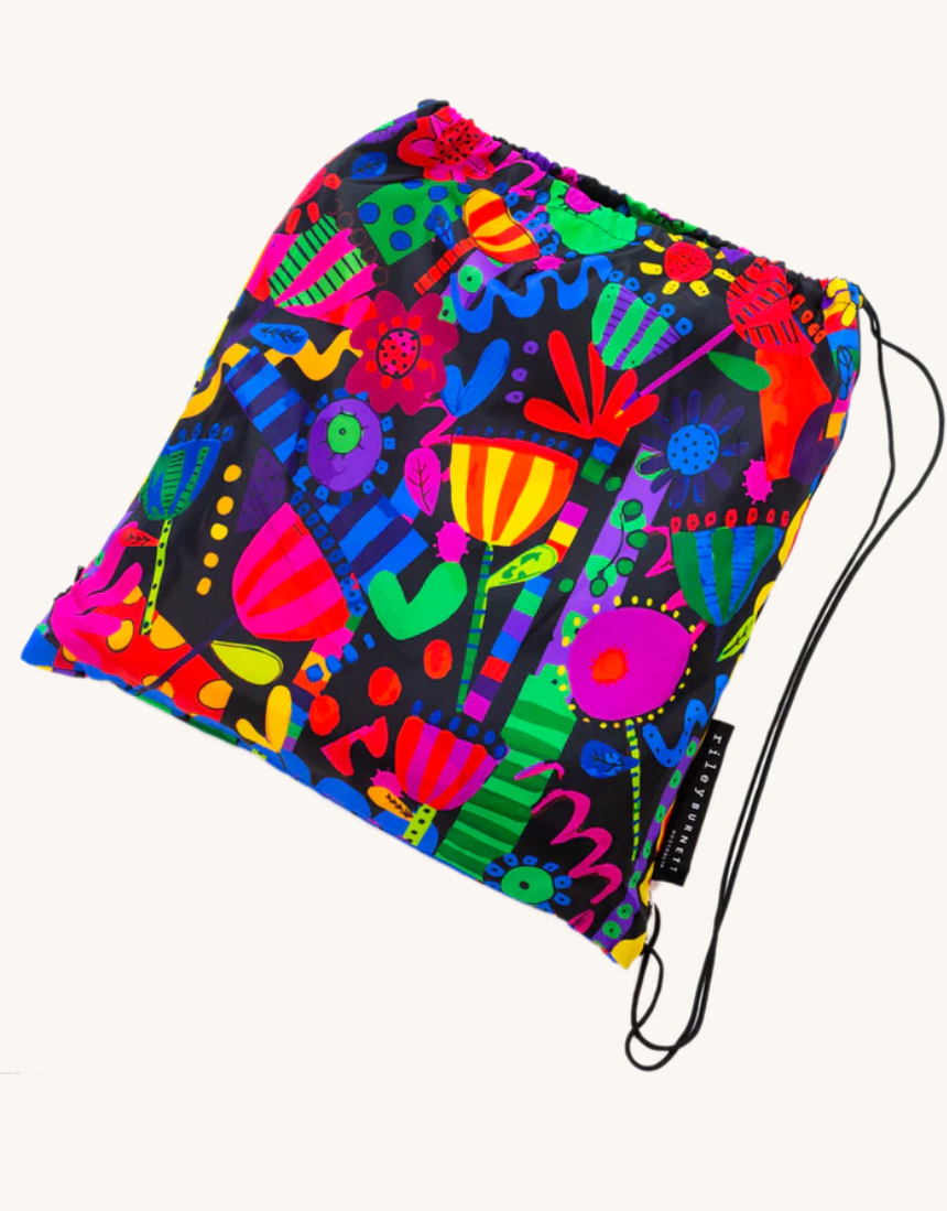 Colorful Flower Fiesta picnic rug by Riley Burnett, featuring vibrant floral patterns on a durable outdoor mat.