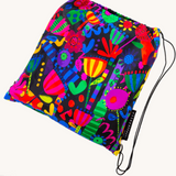 Colorful Flower Fiesta picnic rug by Riley Burnett, featuring vibrant floral patterns on a durable outdoor mat.