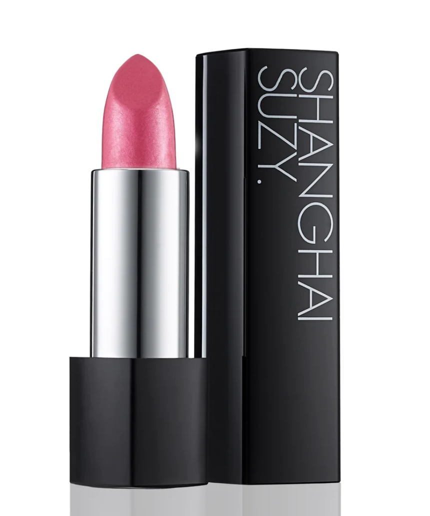Suzy Lipsticks Miss Brooklyn Rose Satin Luxe lipstick with soft pink shade and sleek packaging, displayed close-up.
