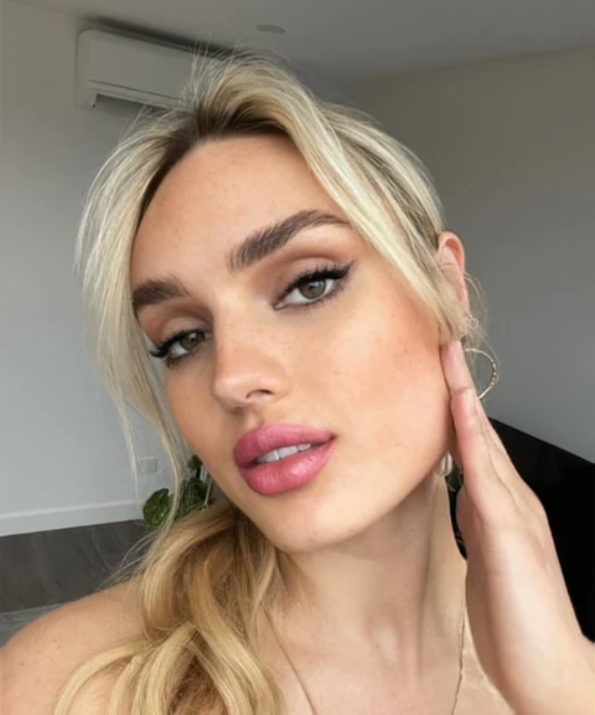 Suzy Lipsticks Miss Brooklyn Rose Satin Luxe lipstick in a sleek tube, showing the rich rose shade and satin finish.