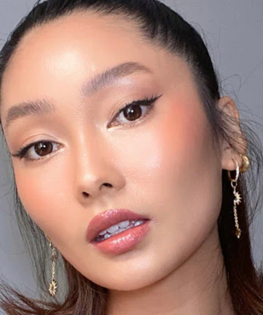 Suzy Lipsticks Miss Celine Dusty Rose satin lipstick in a sleek tube, showcasing its soft pink shade and luxe finish.