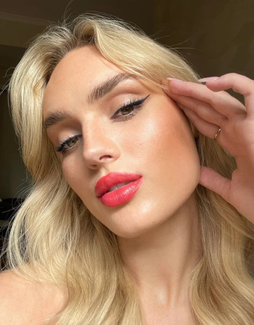 Suzy Lipsticks Suzy x SJ satin lipstick in a sleek tube, featuring a smooth, creamy finish and soft pink shade.